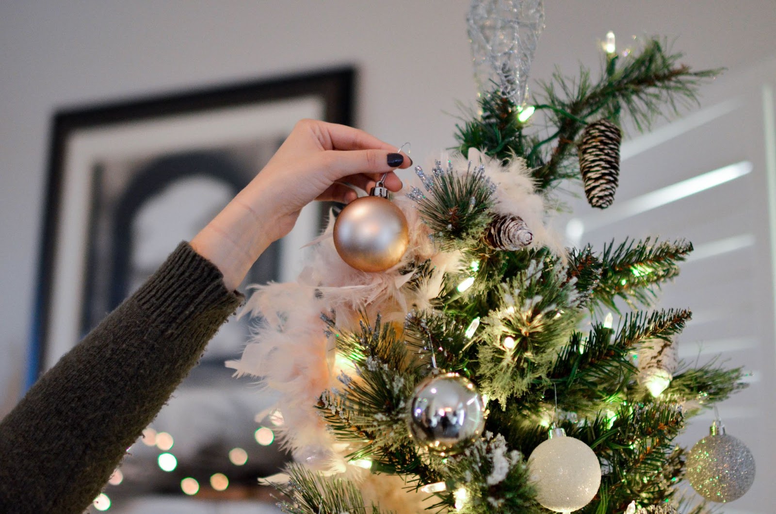 A woman putting Christmas Decorations