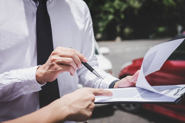 A person signing a document

Description automatically generated