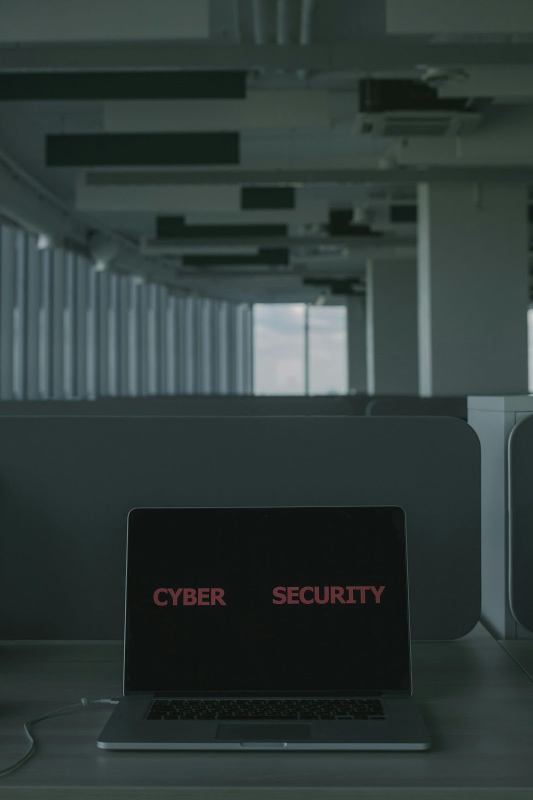 Laptop on a Table Displaying a Cybersecurity Sign on the Screen