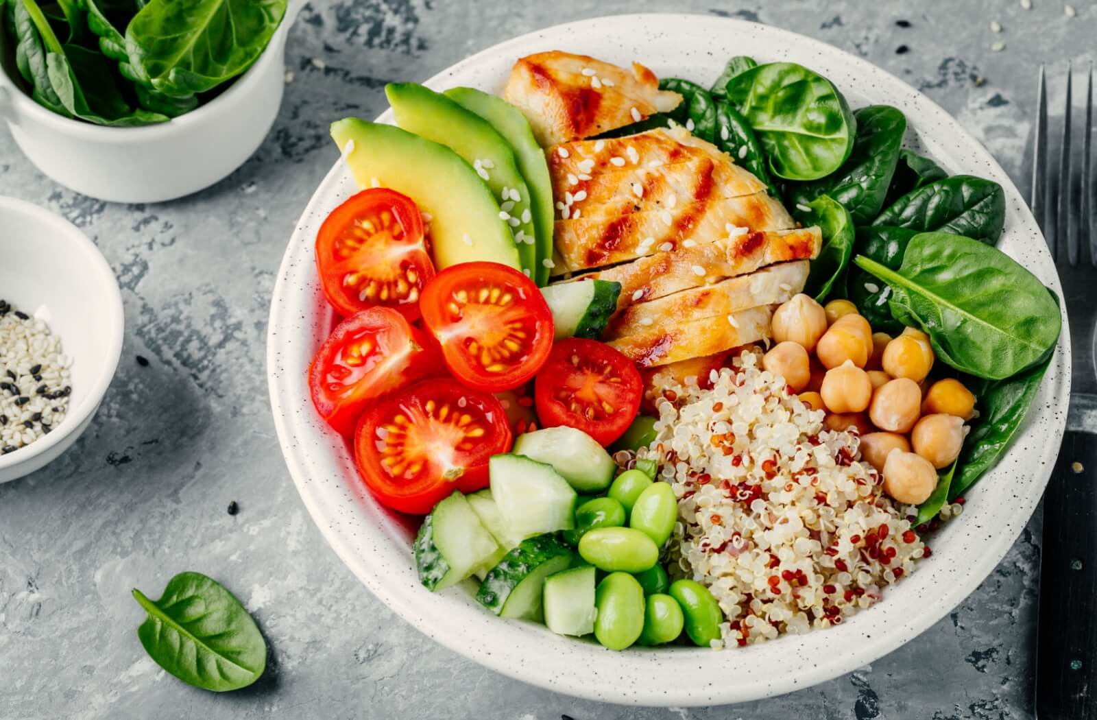 A bowl of salad filled with healthy food.