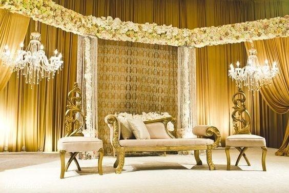 A wedding stage with a couch and chairs

Description automatically generated