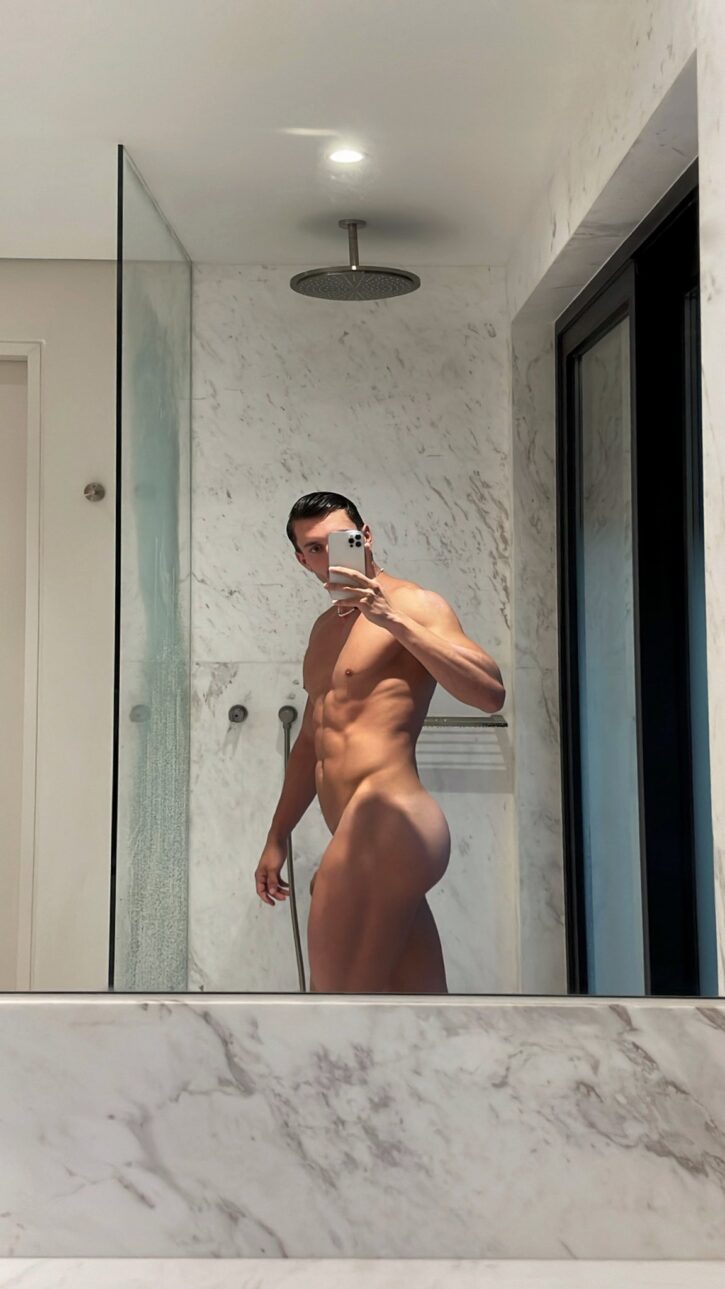 Eric Rmgr onlyfans gay xxx creator taking a naked mirror selfie in marble bathroom shower