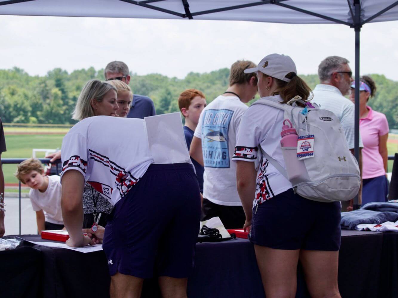 Young lacrosse players checking in to overnight sports camp