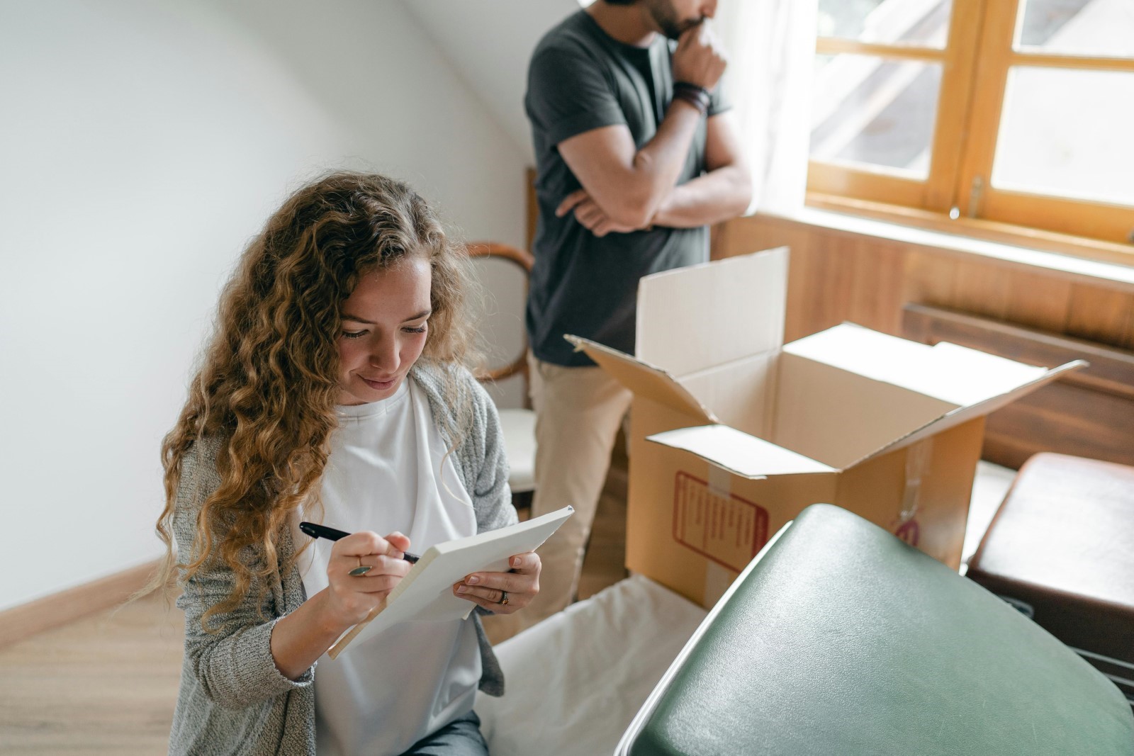 Students packing and going through a check list ready to move out of their accommodation.