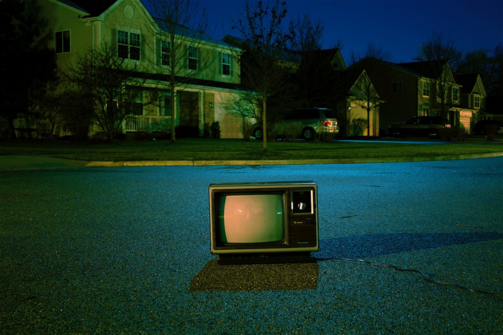 turned off vintage CRT television on road