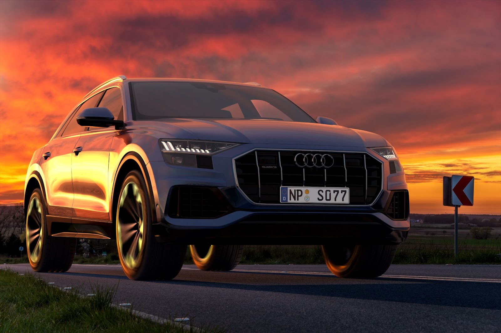 An Audi SUV at sunset on a road