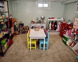 child playing with a therapist in a playroom