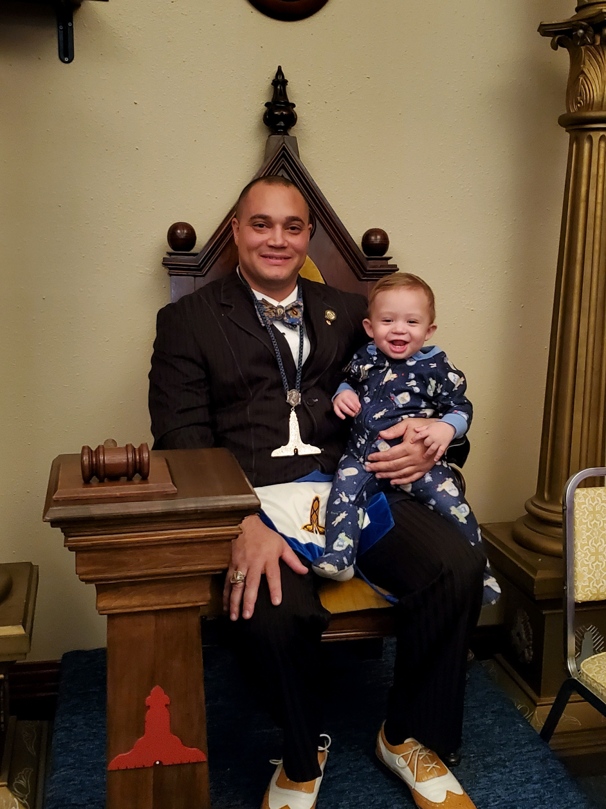 Image of Ohio Mason John Tate with his son at an Officer Installation event at a Masonic lodge.