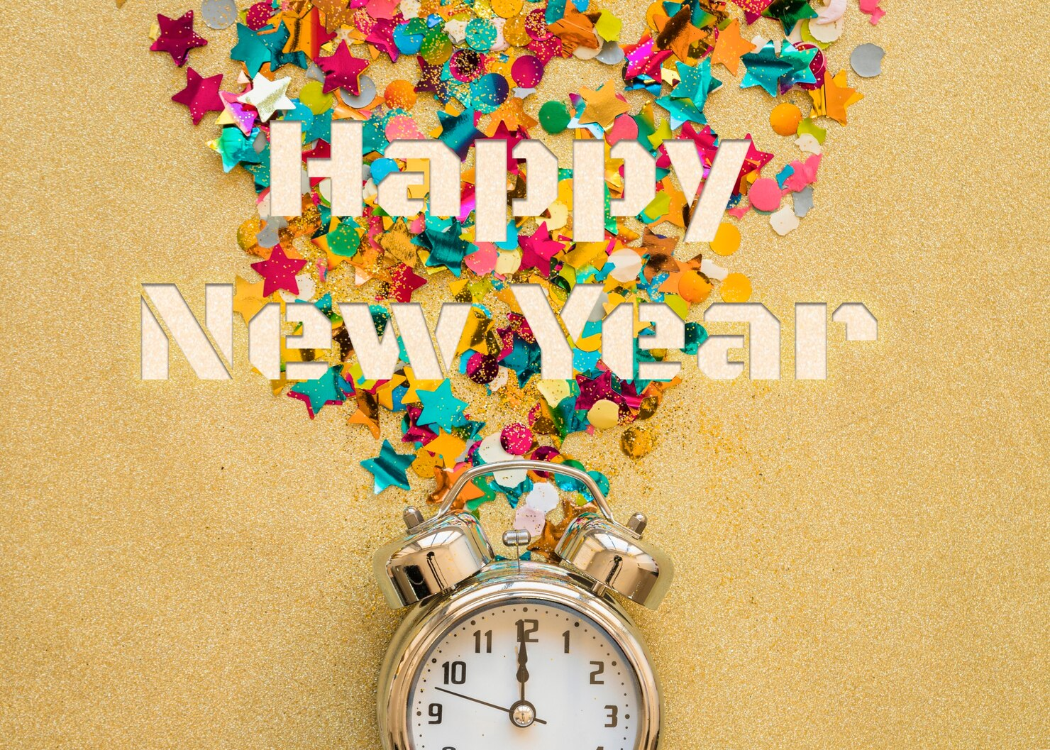 Happy New Year written in confetti with a clock striking midnight. 