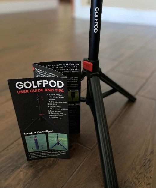 A small tripod with a booklet Description automatically generated