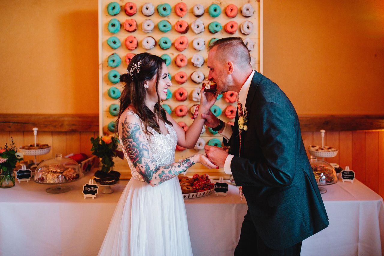 Bride feeding Groom dessert