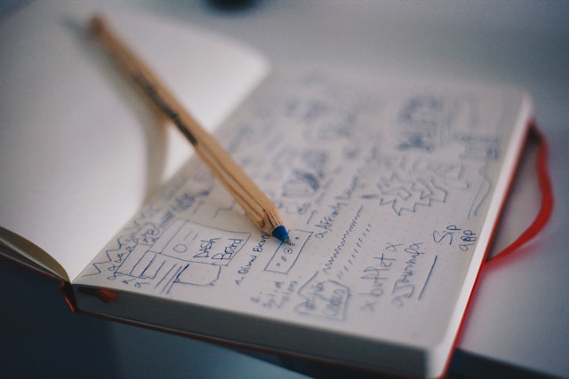 A sketchbook with a sketch of a wireframe to make a prototype used in UI UX design