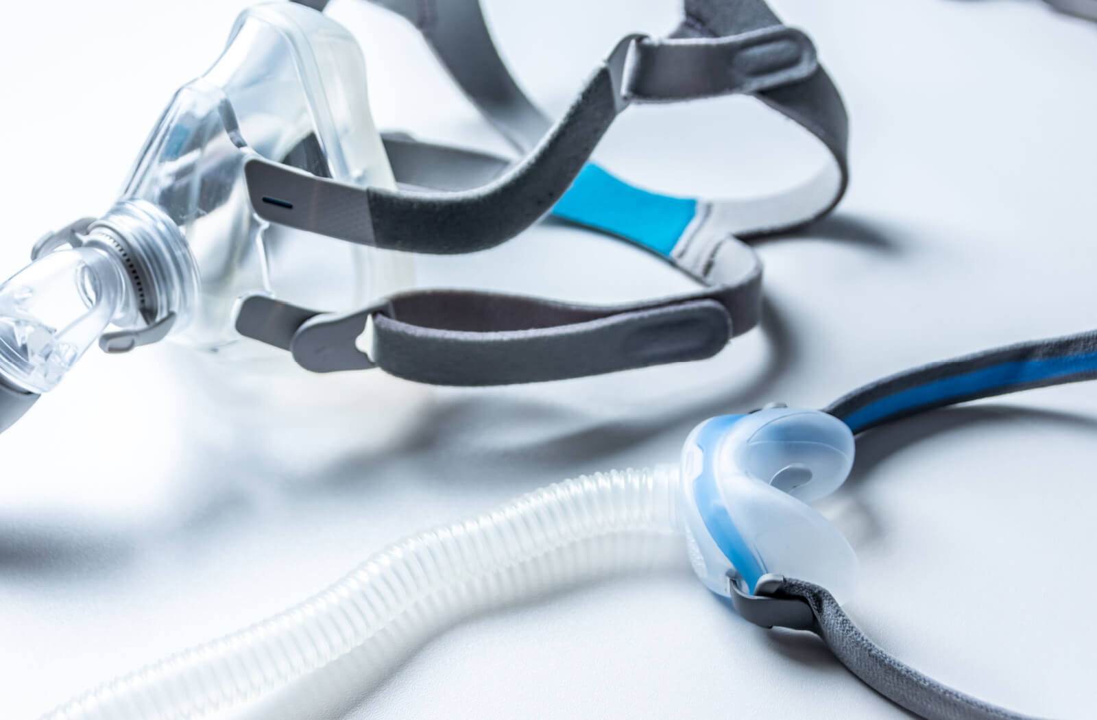 A close-up of a CPAP mask against a white background.