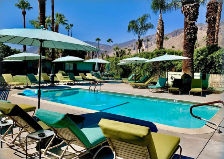 photo of the outdoor pool area and the mountain view of the vista grande gay clothing optional resort in palm springs