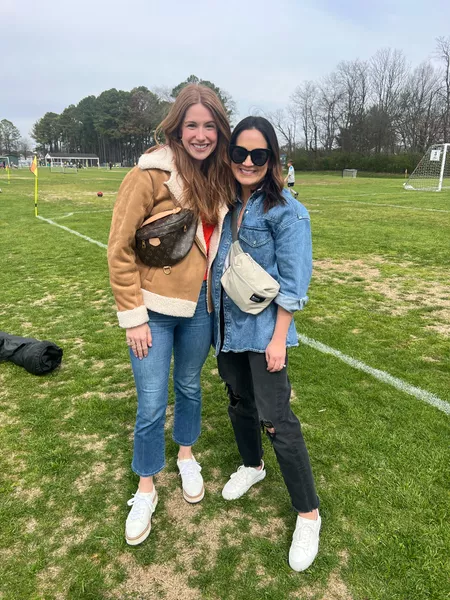 Soccer mom outfits: Picture of two ladies layering their look with a coo jackets like denim