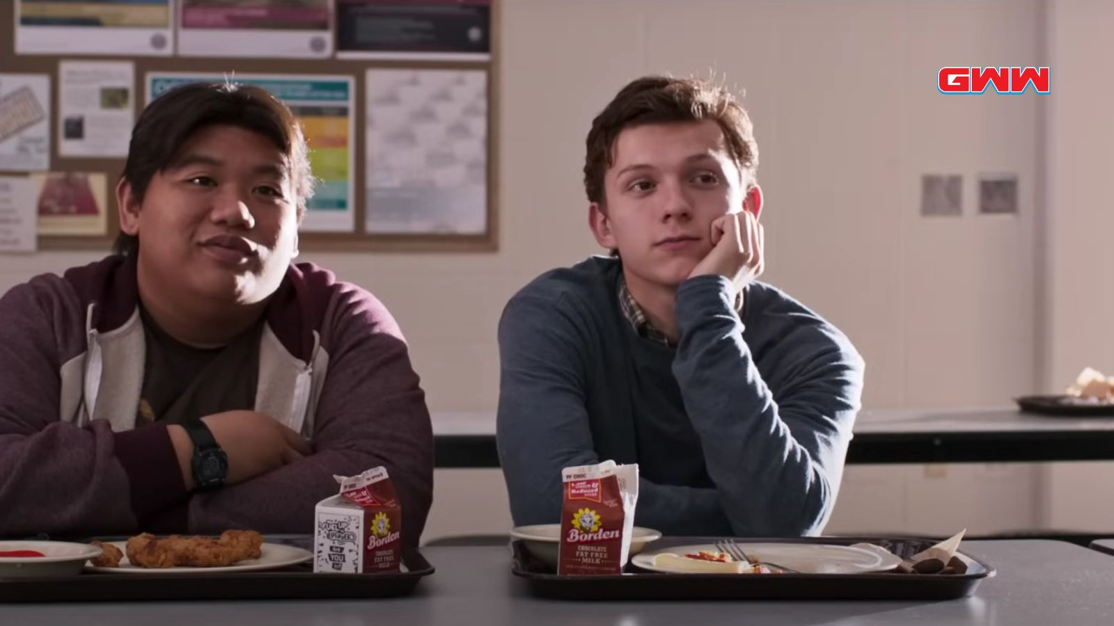 Tom Holland sitting in lunch cafeteria