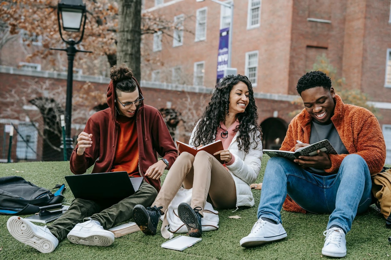 Full body of diverse students studying together