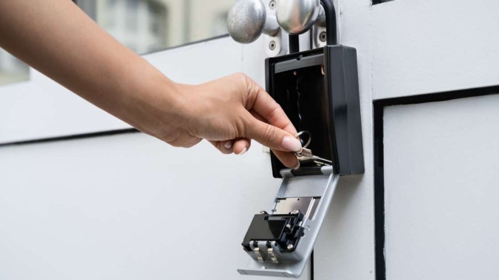 A user getting a key from a key lock box