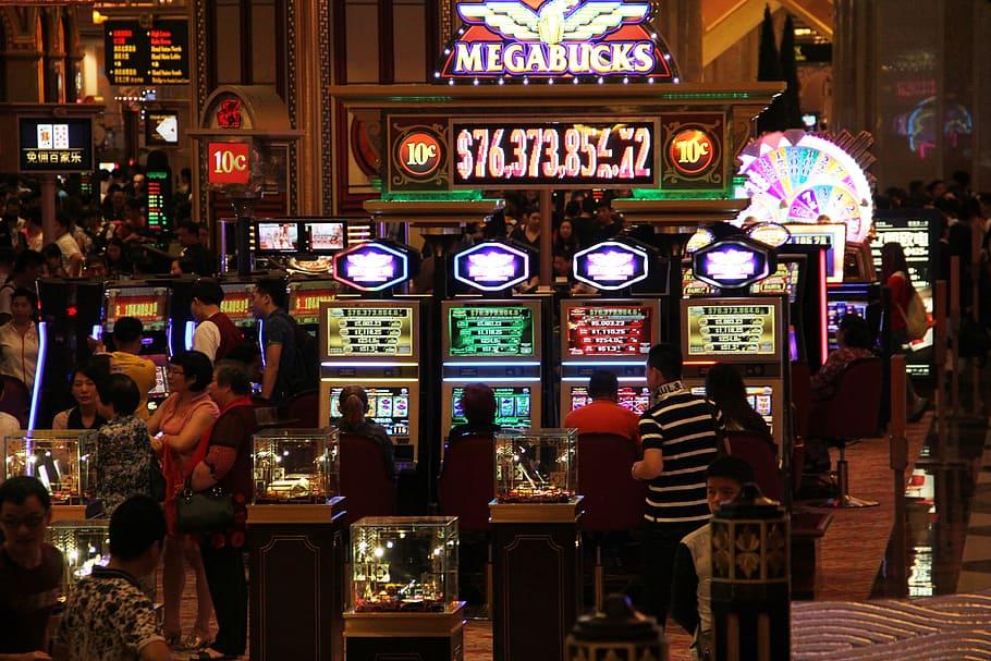 HD wallpaper: man walking in front of slot machines, casino, entertainment  | Wallpaper Flare