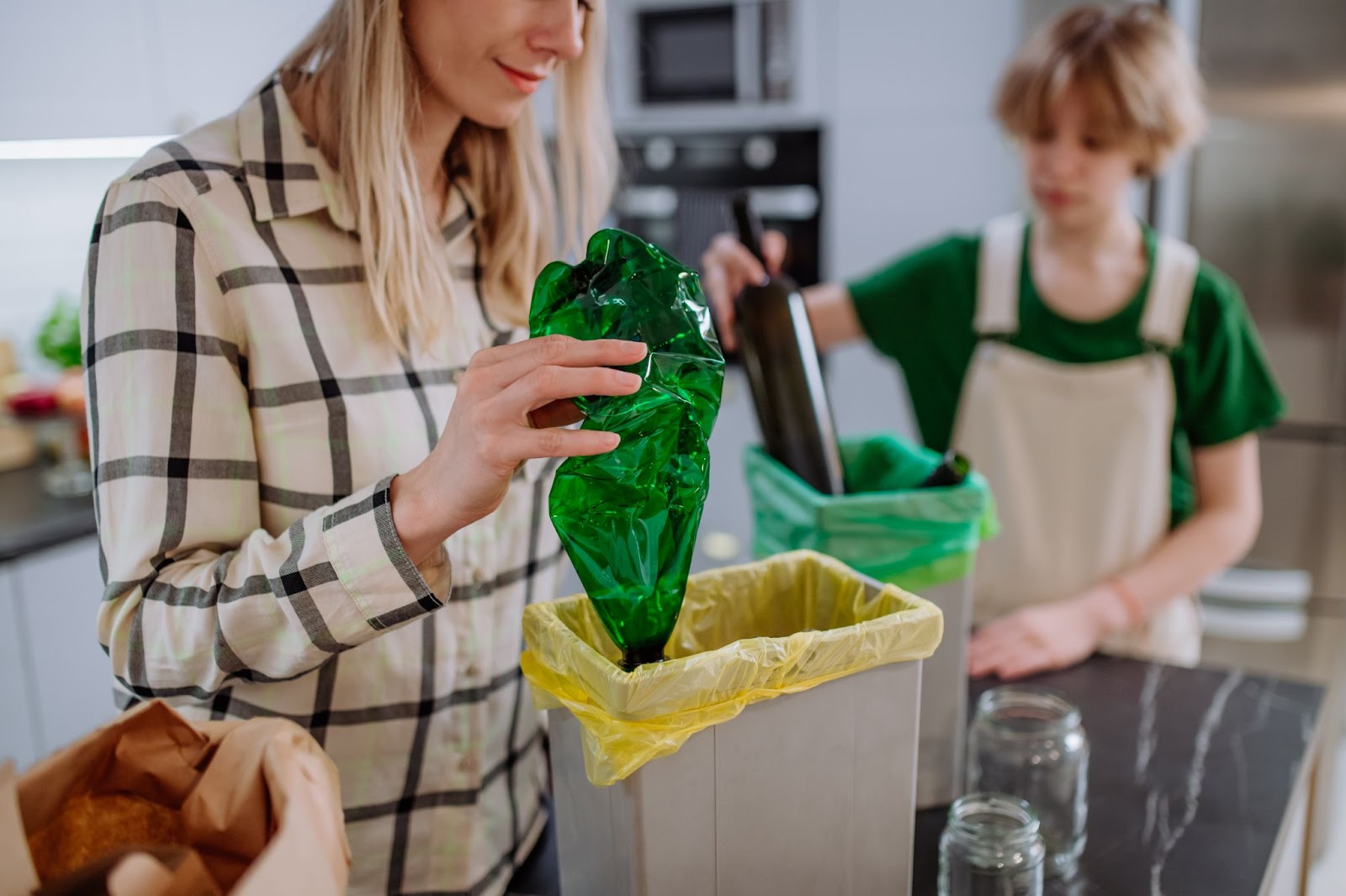 Mom Teaching Her Son Importance of Recycling