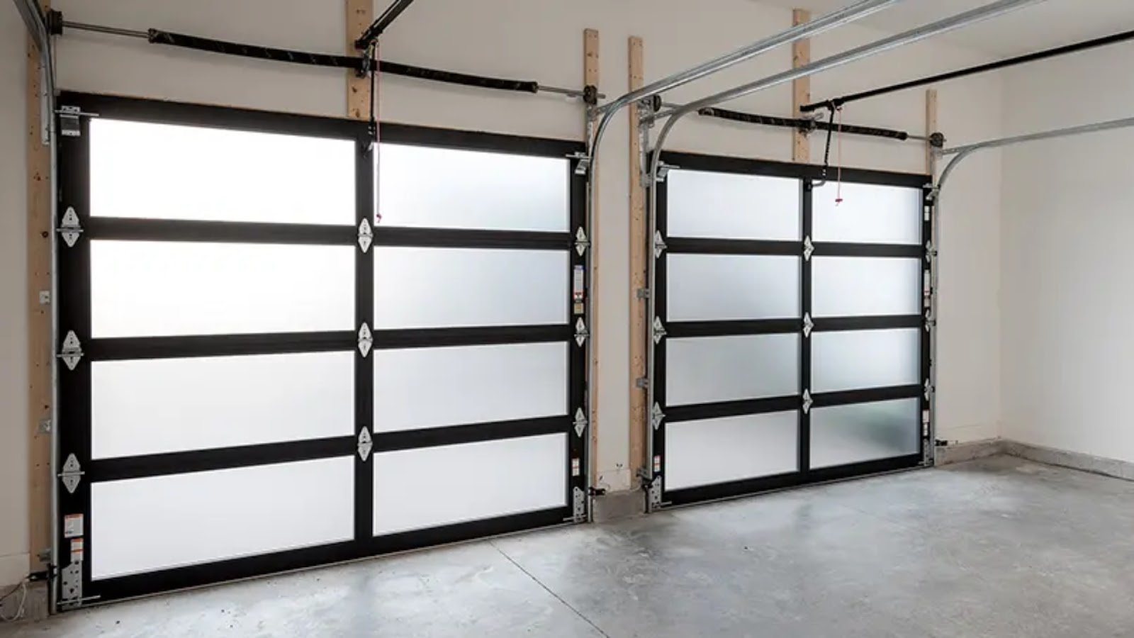 A garage with two glass garages