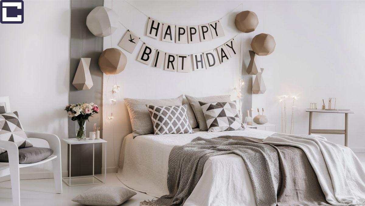 This image features a birthday  bedroom decoration in a minimalist chic style for a birthday celebration. The room is adorned with sleek furniture and geometric-shaped decorations. A neutral color scheme of white, beige, and gray creates a modern and sophisticated ambiance. The bed is elegantly made with crisp linens, complemented by geometric-patterned throw pillows. A minimalist bedside table holds a vase of fresh flowers, adding a touch of natural beauty to the space. The overall aesthetic is clean, stylish, and timeless.