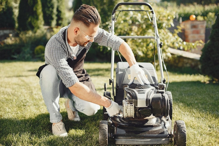 a man using a lawn mower