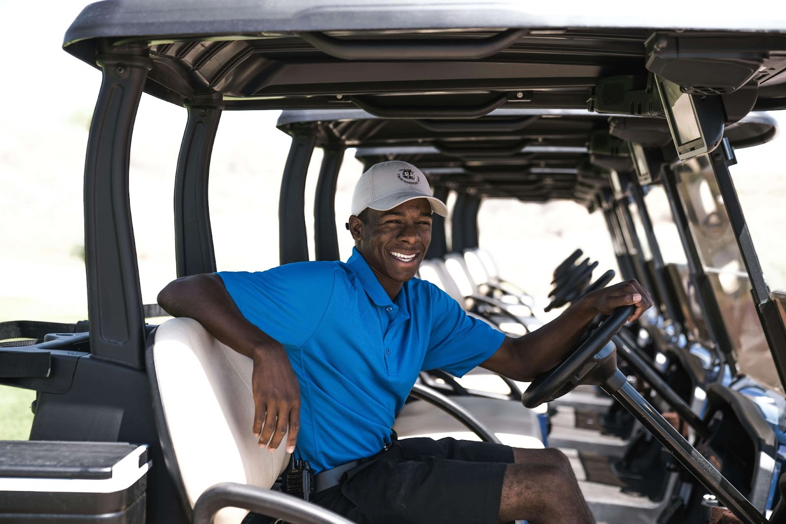 Man smiling in golf cart