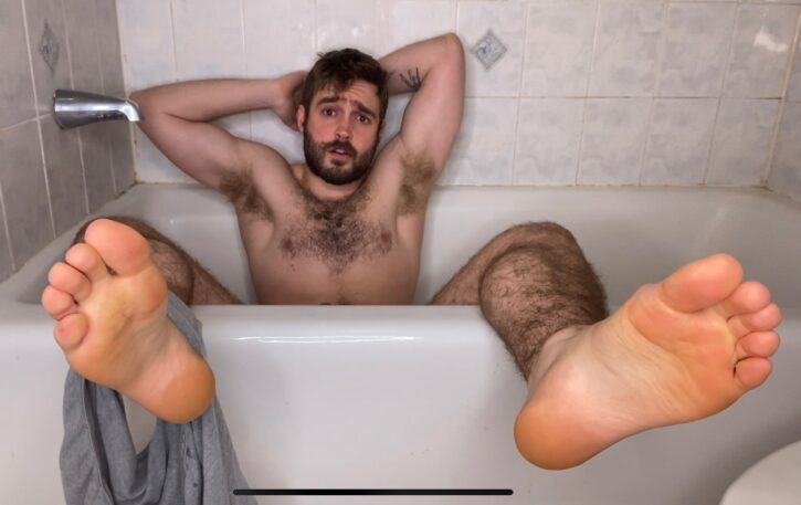 Forest Cliff naked in the tub showing off his naked feet for his gay foot fetish fans with his grey underwear around his right ankle