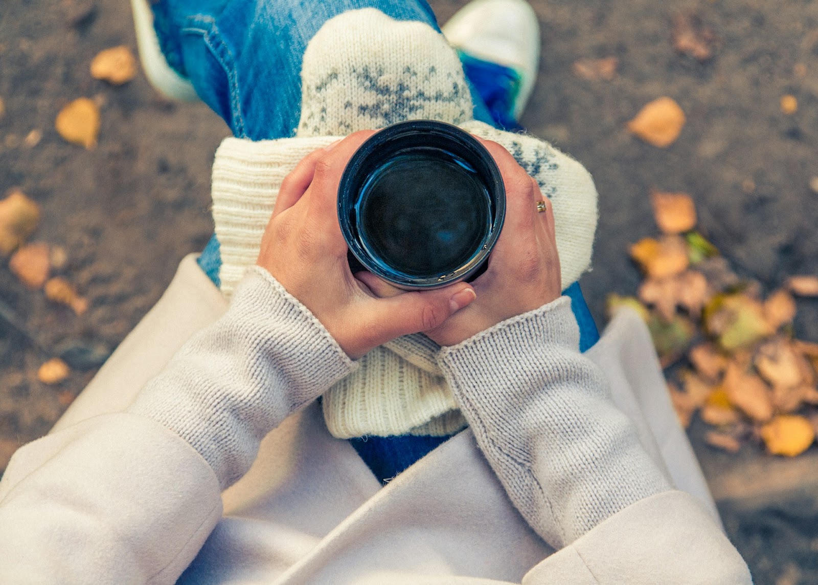 person holding cup of coffee