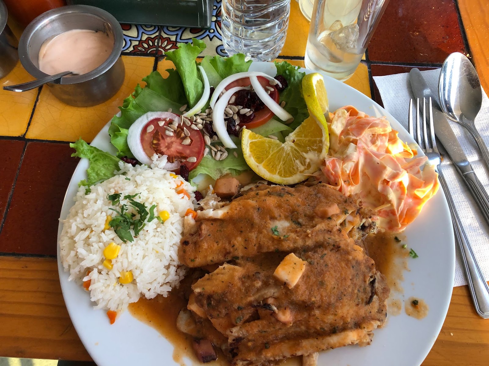 Tilapia fish with rice and salad at El Delfin restaurant in Ixtapan de La Sal, Mexico. 