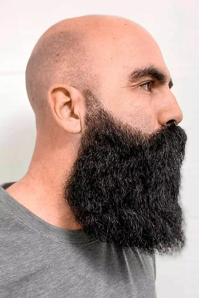 Picture of a man with shaved head and full coarse beard