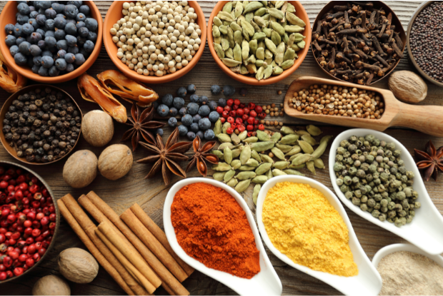 A group of different spices in bowls

Description automatically generated