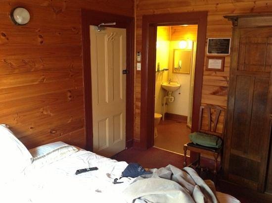 picture of the bed and the private bathroom in a private guestroom in the laird gay guesthouse and bar in melbourne, australia