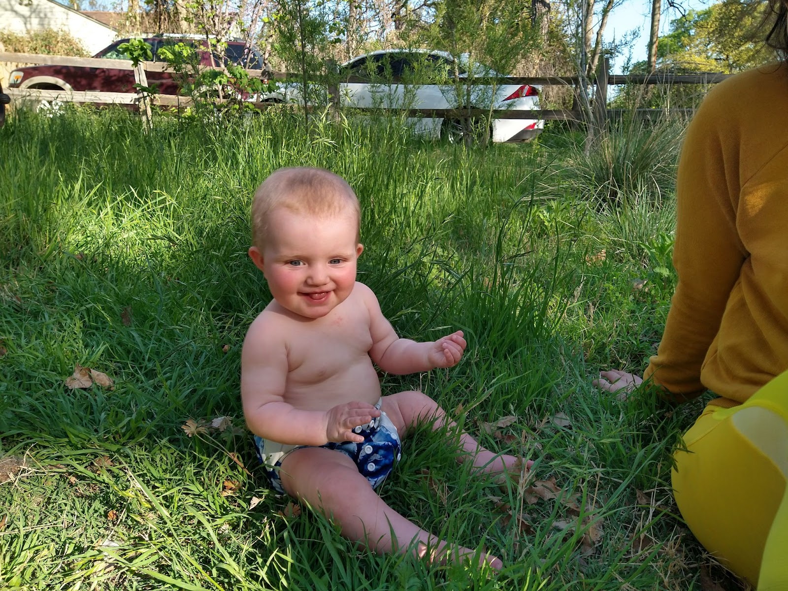 baby happy in front of michael's pocket prairie in 2022