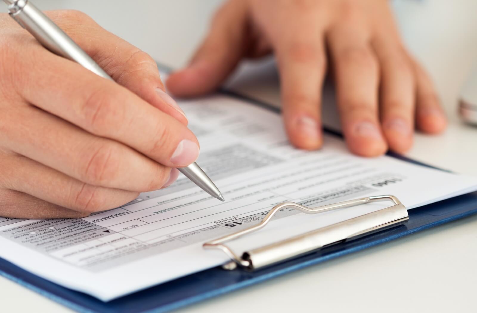 A close-up of a form being filled out by a person.
