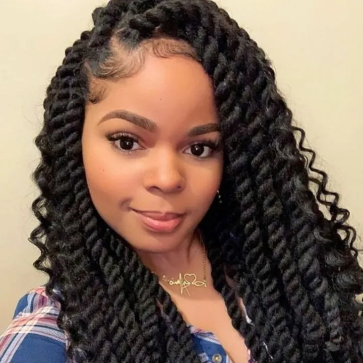 Close up view of a lady rocking the Bohemian twist cuban hairstyle