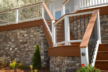 trex transcend railing composite deck with stairs and stone facing custom built michigan
