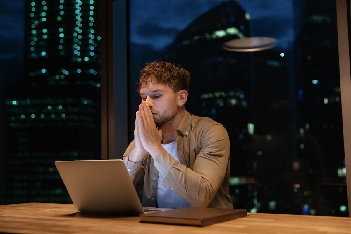 ADHD accommodations at work: entrepreneur looking at his laptop
