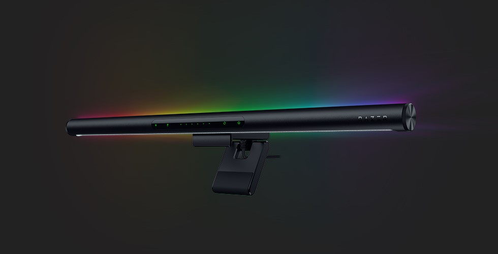 A black object with a rainbow colored light

Description automatically generated
