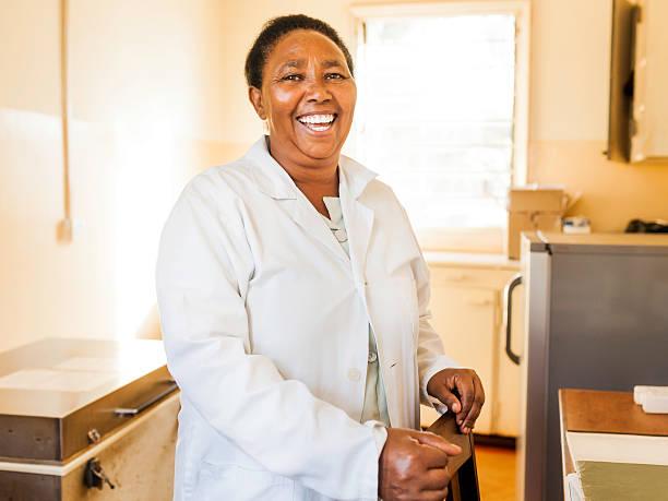 smiling african nurse - doctor kenya stock pictures, royalty-free photos & images