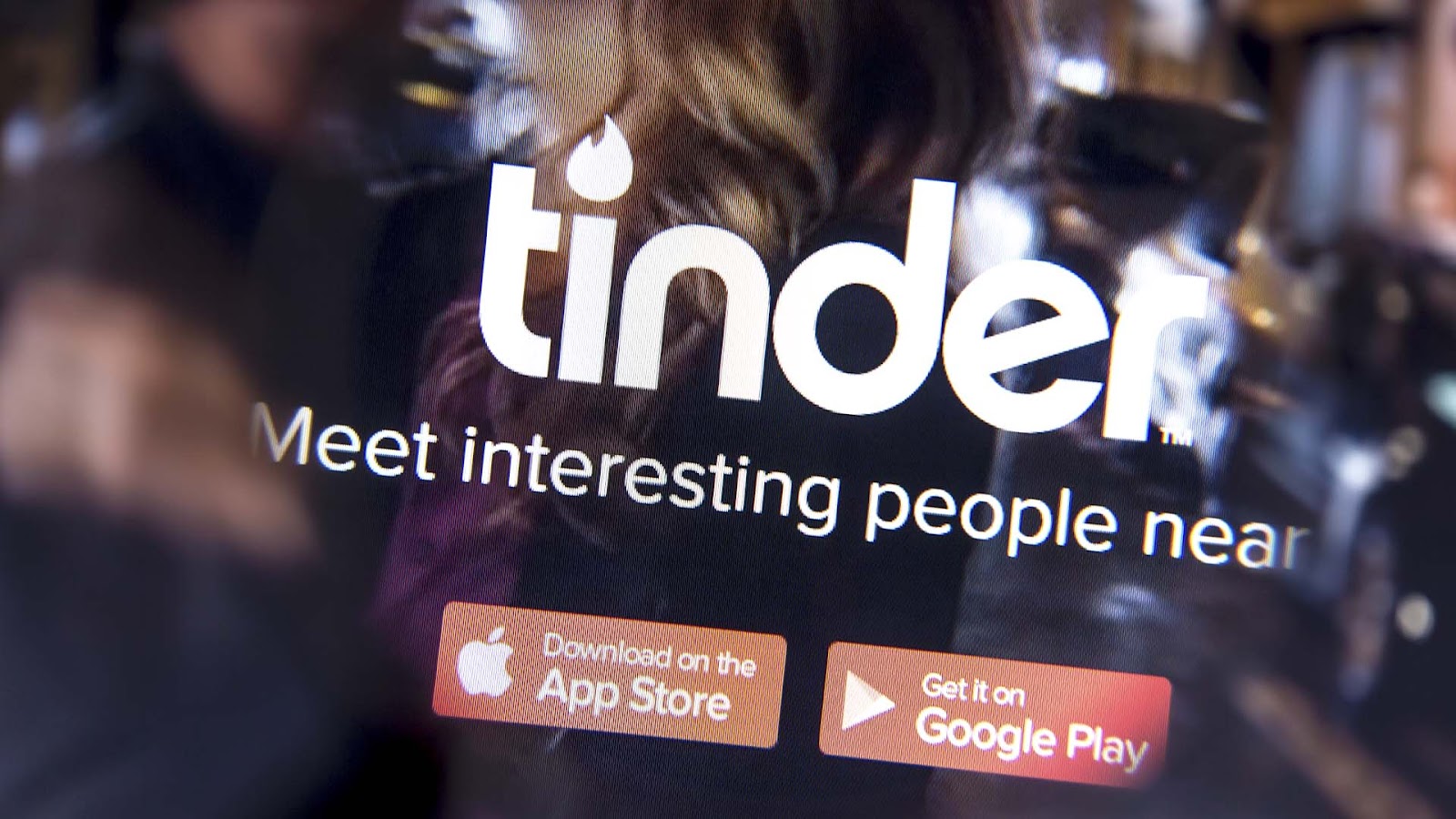 Blurred out image of the Tinder homepage