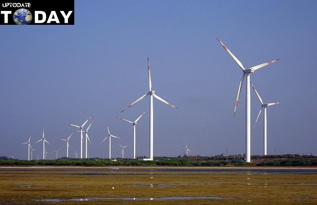 A group of wind turbines in a field

Description automatically generated