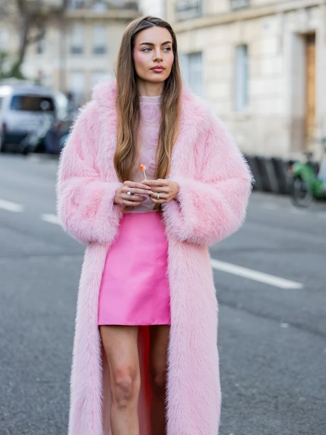 Paris Haute Couture Week 2024: Picture of an attendee in a pink gown and and faur fur to match for the event