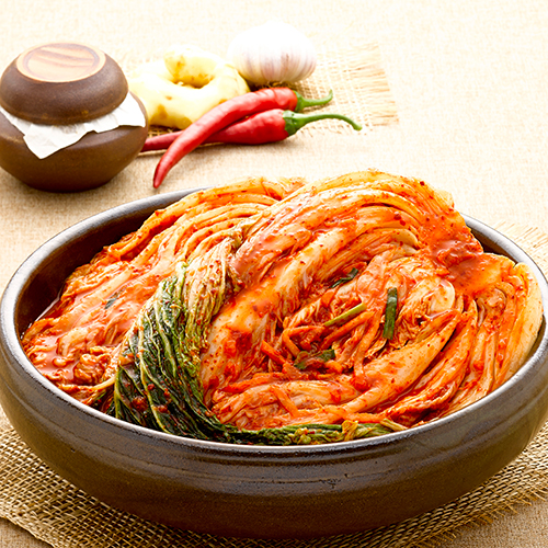 A bowl of kimchi on a table

Description automatically generated