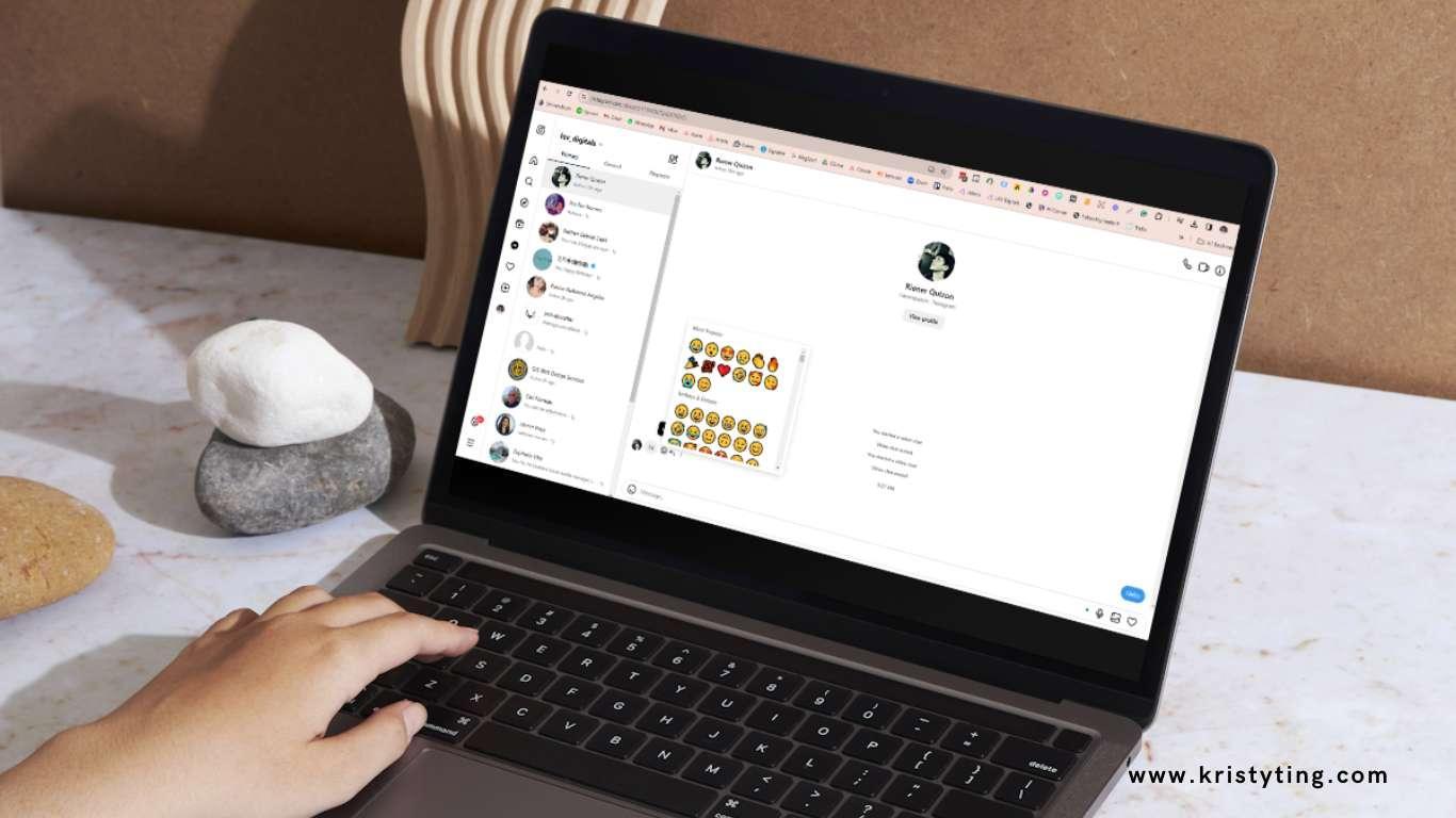 How to React to Instagram Messages - Hands typing on a laptop with a chat window and emoji selection visible.