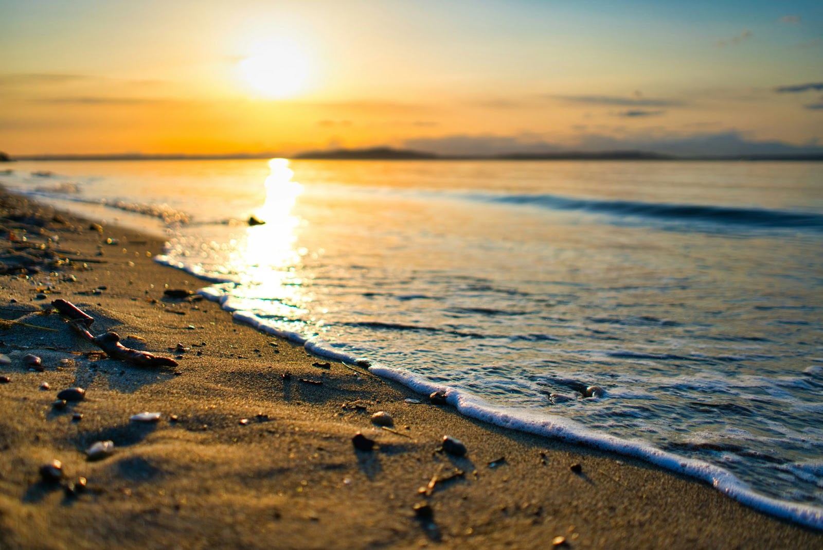 a sunset on a beach at Alki Beach