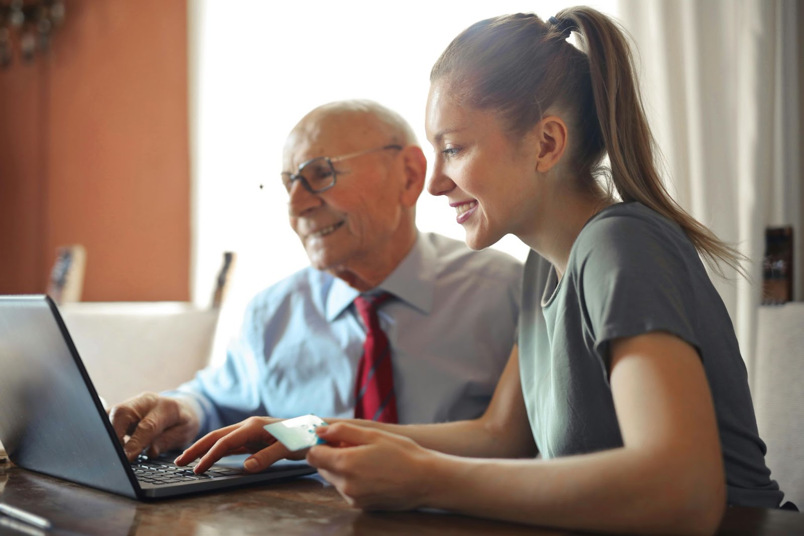 A senior and an elder financial abuse attorney person using a laptop.