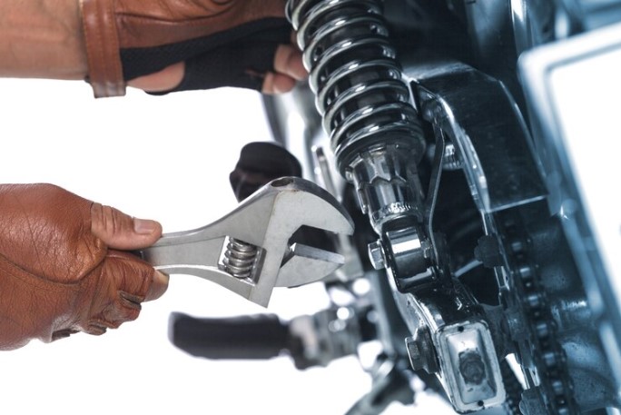 Mechanic Repairing a Motorcycle