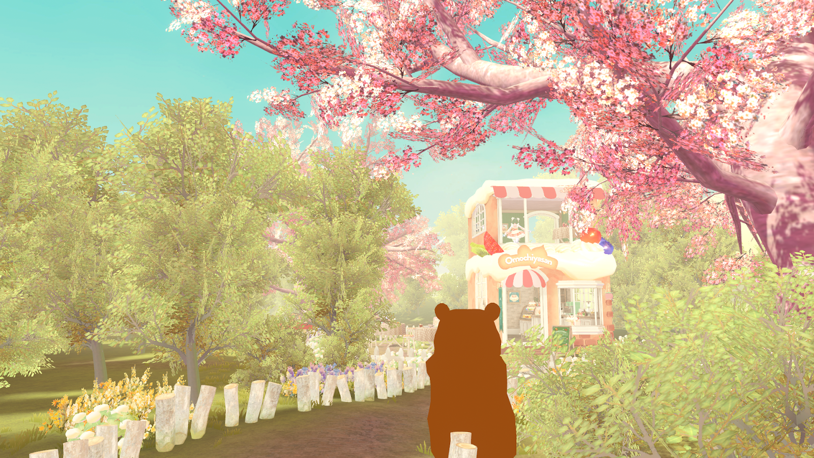 桜が咲く森の中、筆者が小道を歩く画像
